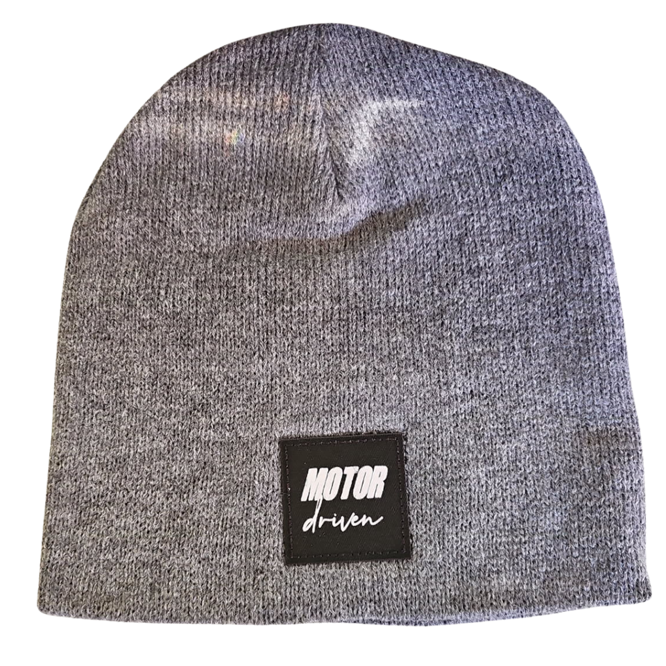 Gray knit beanie featuring a black "Motor Driven" patch on the front.