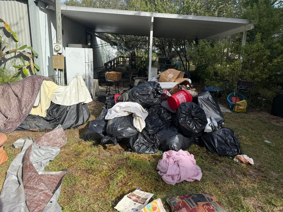 Junk in someone's yard, about to be hauled away by JNJ Hauling Solutions of Citrus County