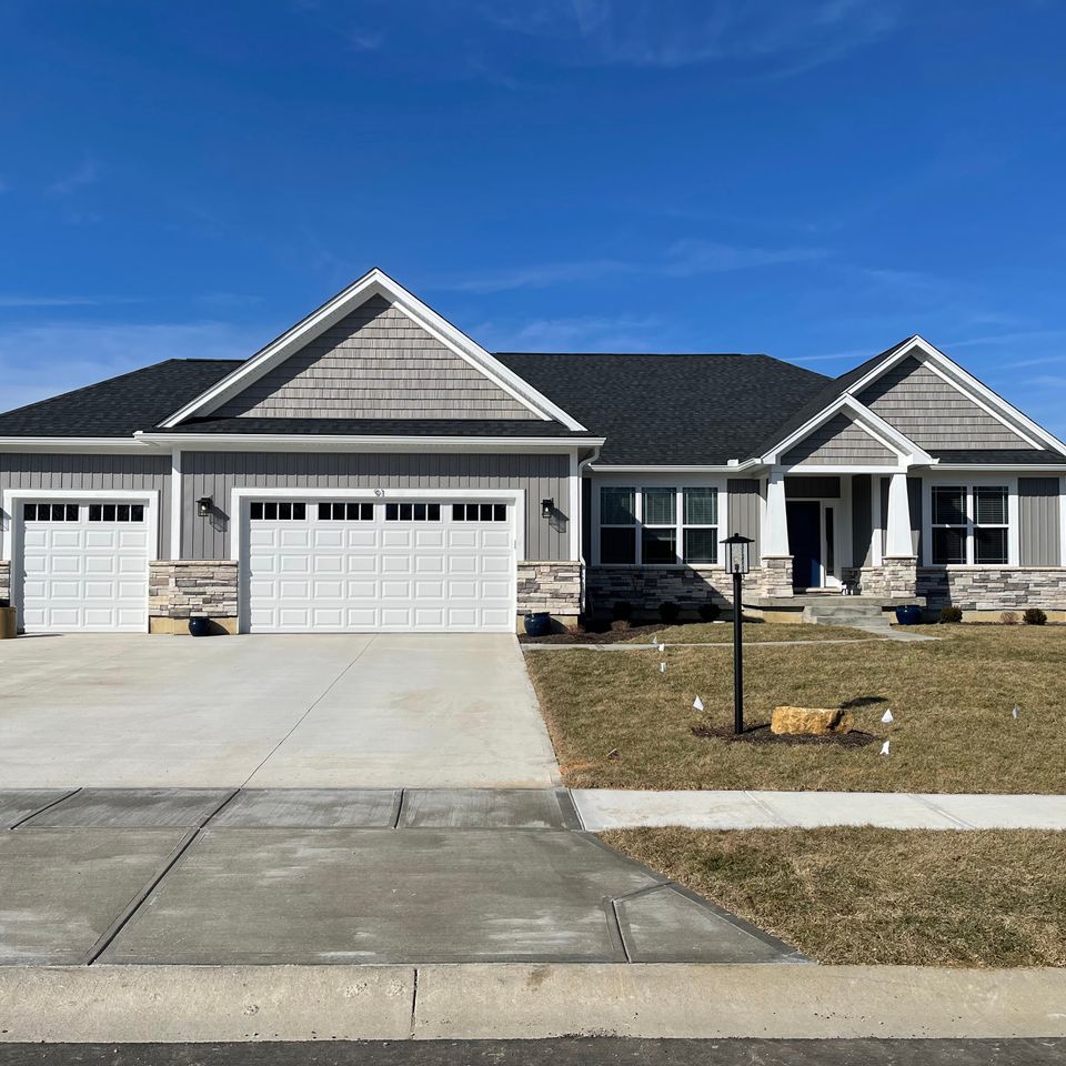 Single-story home with a professionally installed gray asphalt shingle roof by E & D Roofing, Inc.
