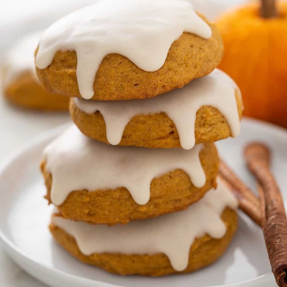 Stacked pumpkin cookies on plate