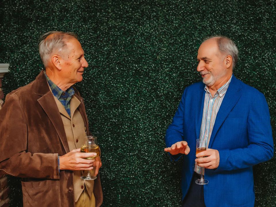 Two businessmen enjoying Heavy Branch Cider.