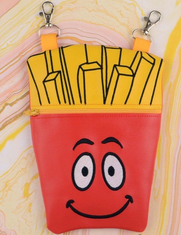 Custom embroidered zipper pouch shaped like a french fries container with a smiling face and bright yellow fries.
