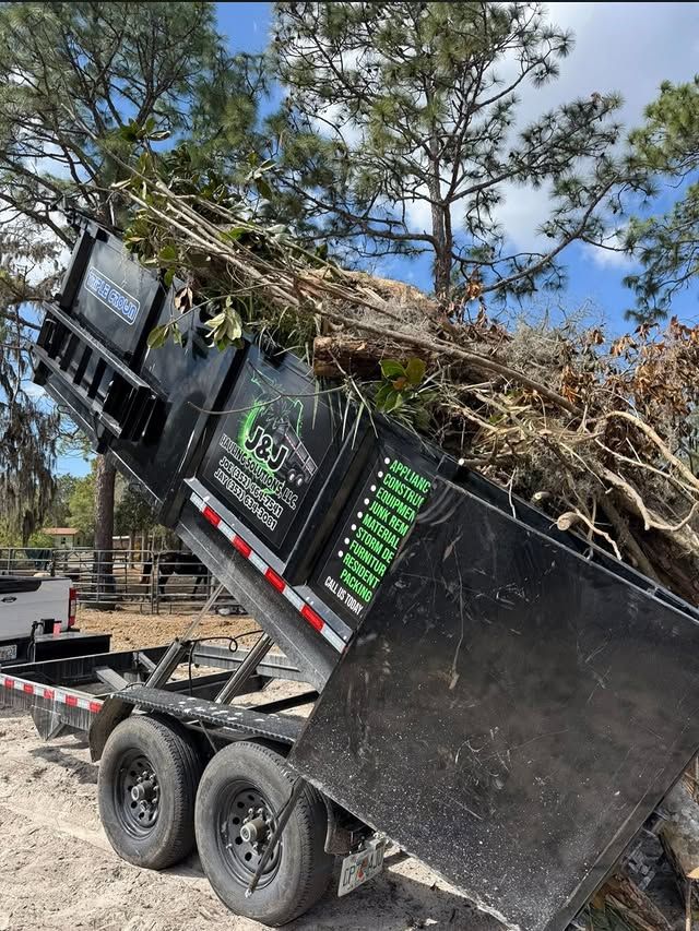 JNJ Hauling Solutions dumpster in the emptying position