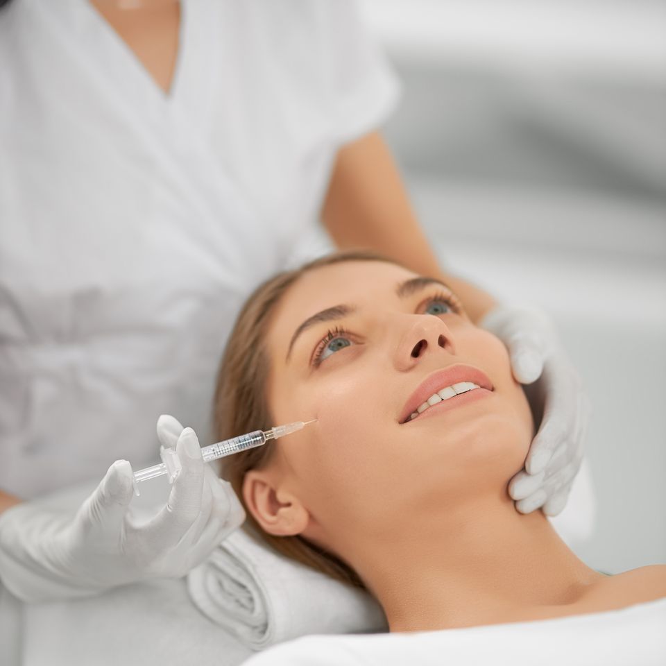 Smiling woman doing procedure tighten skin