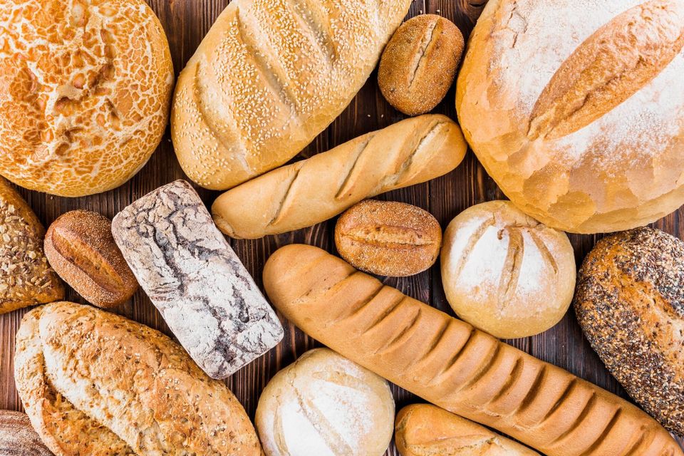 Different fresh baked bread table 23 2147872499