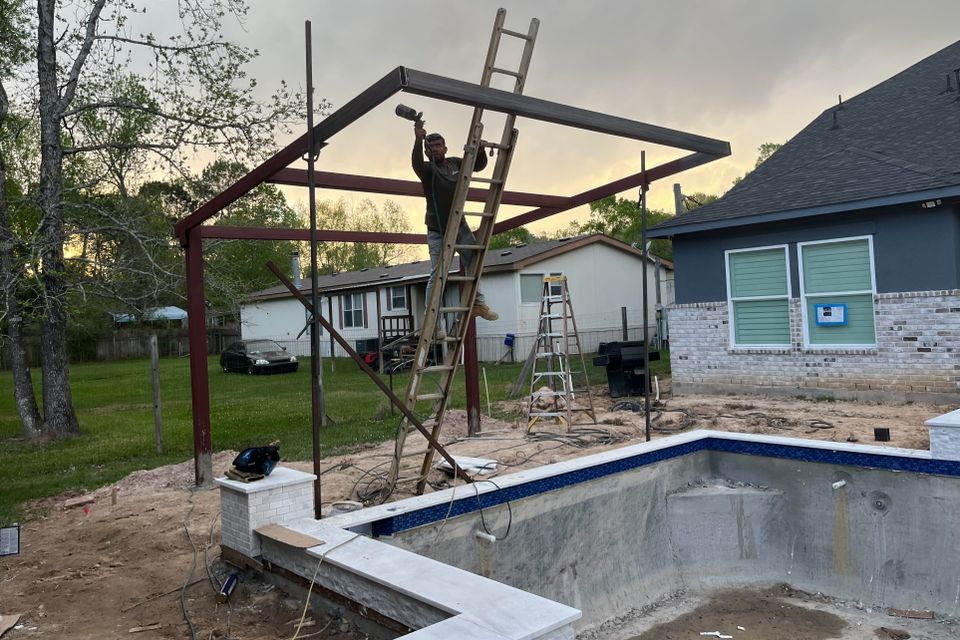 Steel frame construction for a custom poolside cabana and outdoor entertainment area in Houston, Texas.