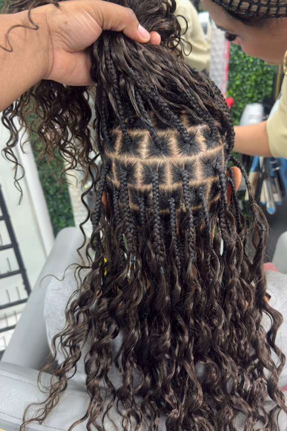 woman with extensions being put on