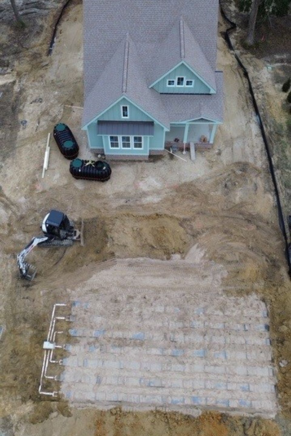 E&J Residential installing a new septic system for a new homeowner.