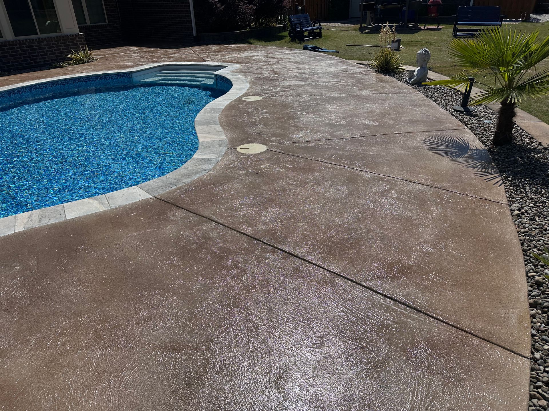 After photo of decorative concrete finish around pool in Beech Island South Carolina