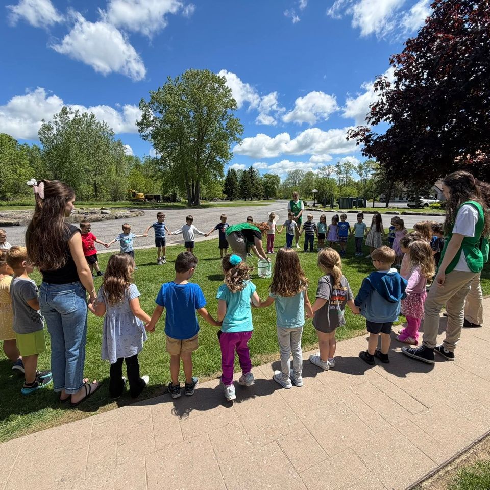 Students and teachers in a circle outside one of our facilities.