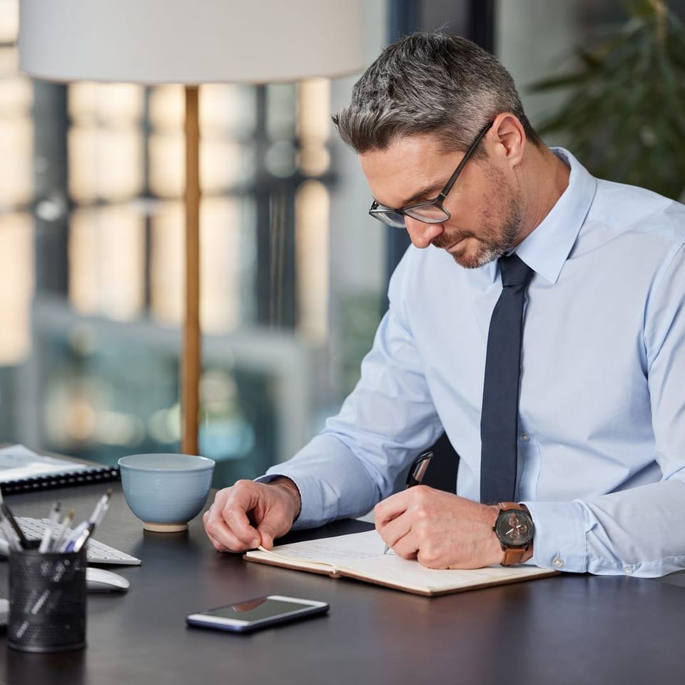 59332864 business writing and man with notebook planning and ideas for schedule project and startup person at desk compliance officer and employee with professional corporate and career ambition