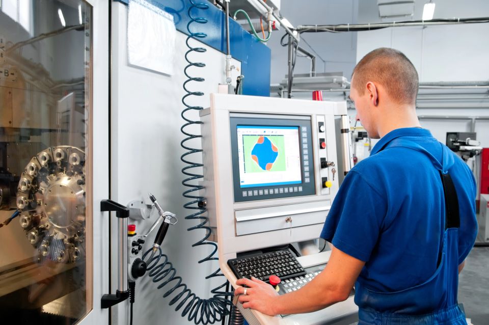 Vistacreate 5428295 stock photo worker operating cnc machine center