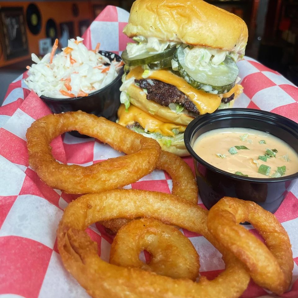 Coleslaw, burger and onion rings from Inferno The Restaurant in Sound Beach