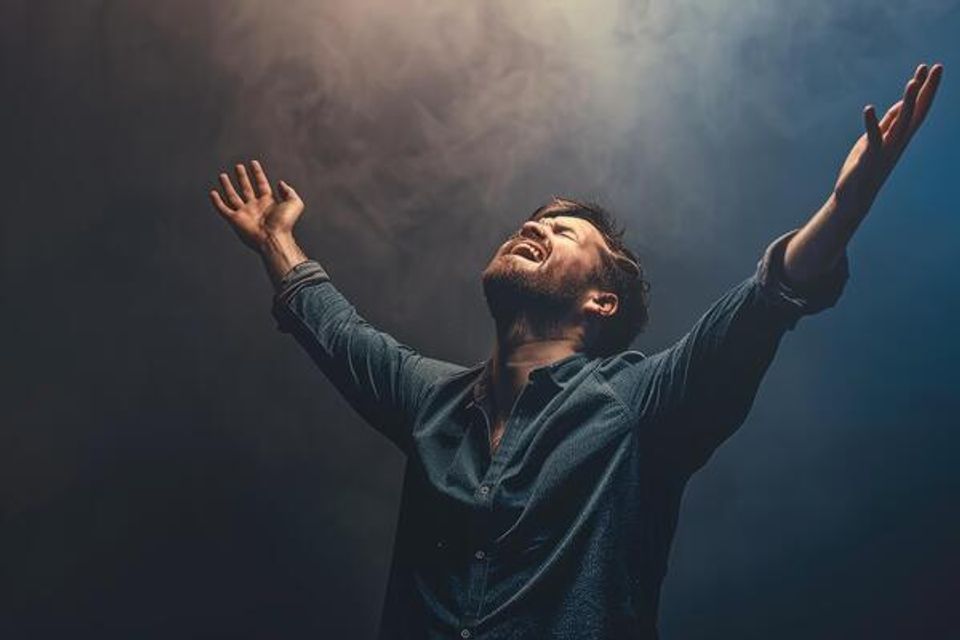 Ai generated a christian man praying to god crying and emotional with his arms raised photo