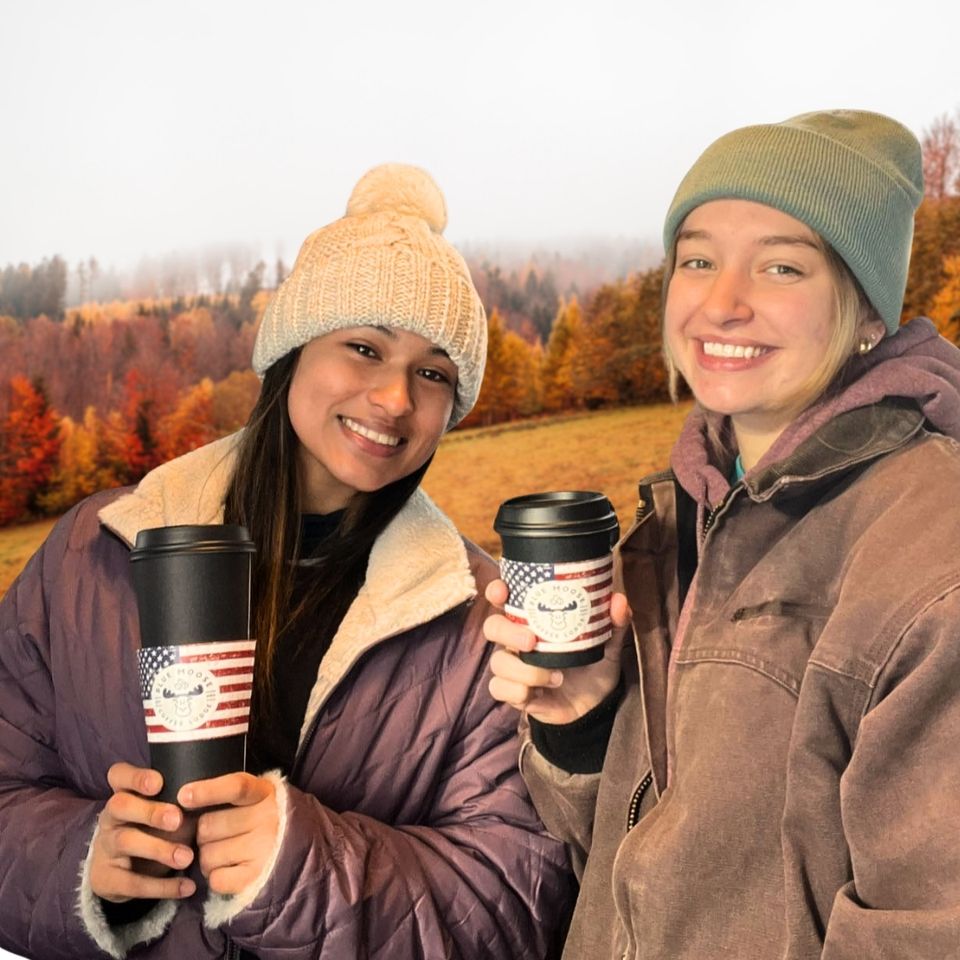 Two people enjoying a cup of Blue Moose Coffee