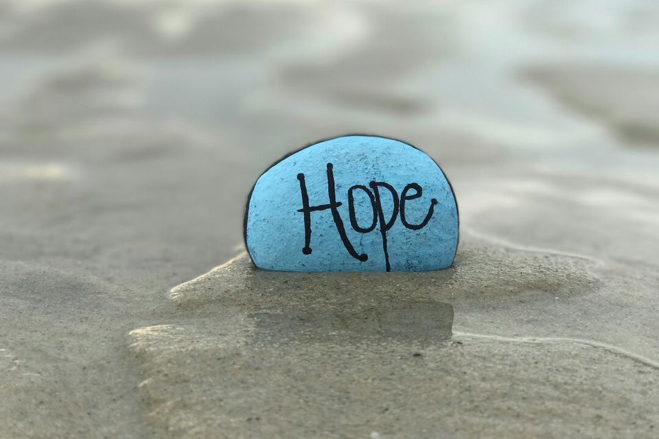 Rock with hope written on it. 