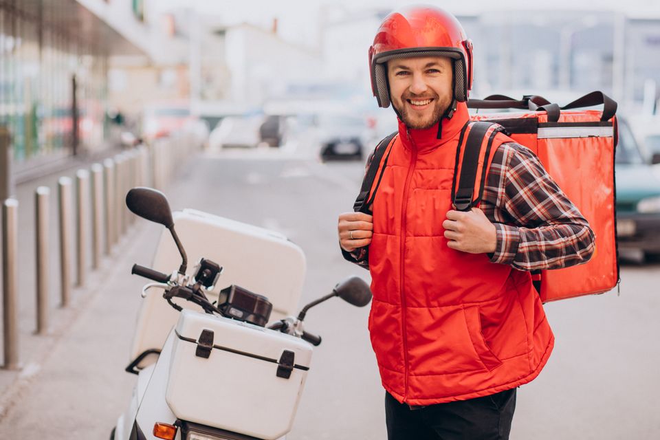 Food delivery boy delivering food scooter