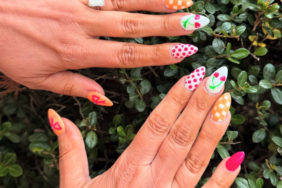 Nail technician student practicing manicure techniques in training salon