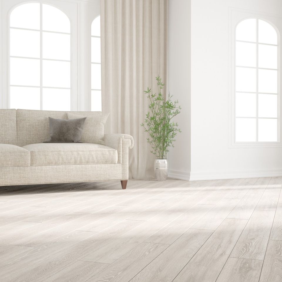 Bright and modern white oak hardwood flooring installed throughout a spacious open-concept home by Concord Carpet And Hardwood.