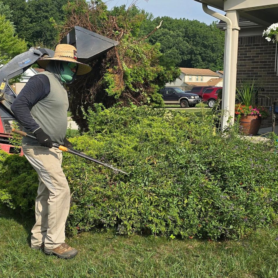 Workers of Vic's Landscaping working during seasonal cleanup