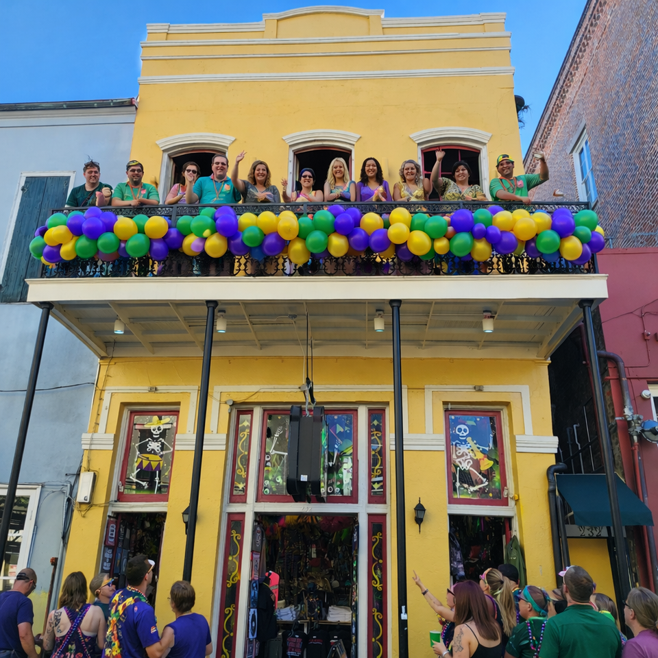 232 Balcony on Bourbon decorated with purple, yellow and green balloons for Mardi Gras.