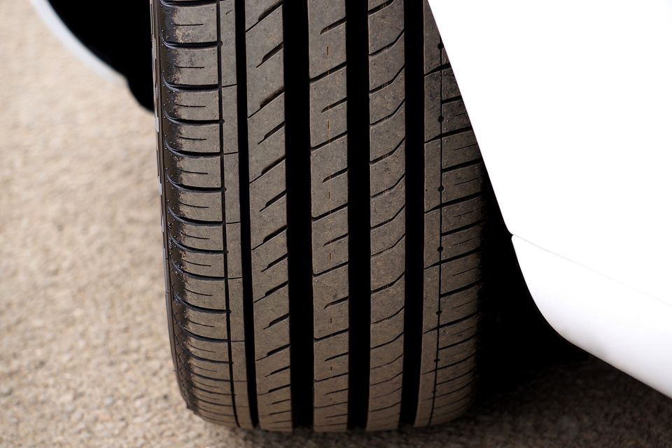Close up image if a car with new "Sport Design Tread" tires freshly mounted.