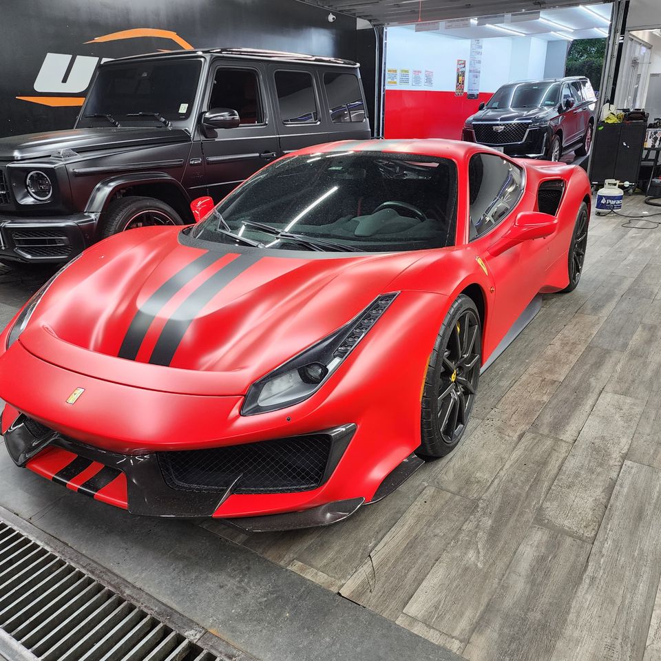 Professionally wrapped red Lamborghini sports car
