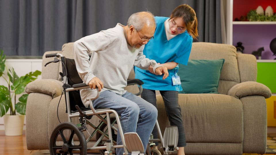 Elderly patient on wheelchair trying to stand and 2023 11 27 05 23 12 utc