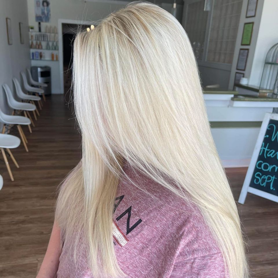 Long straight bright blonde hair with glossy finish after color service in Columbiana AL