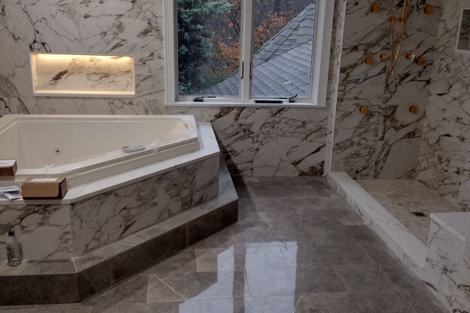 A gorgeous floor installation for a bathroom, done by Taurus Contracting Inc. of Suffolk County , NY