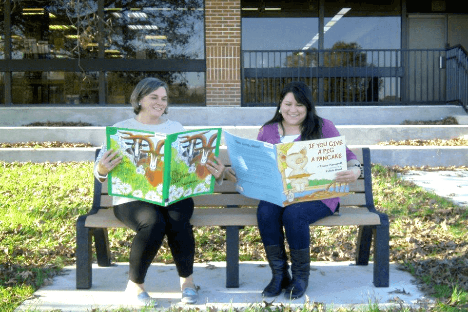 Ladies reading on a bench