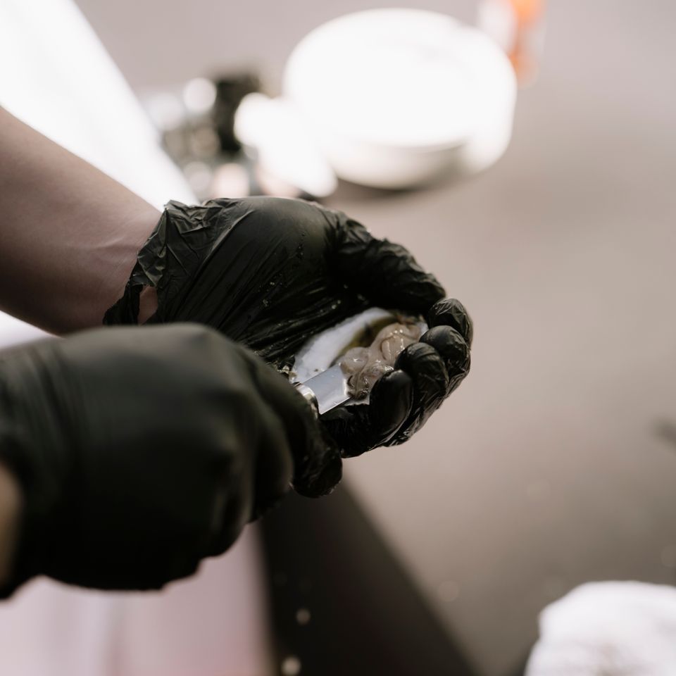 Clam shucking, done by Shore2Shore Shucking of Long Island