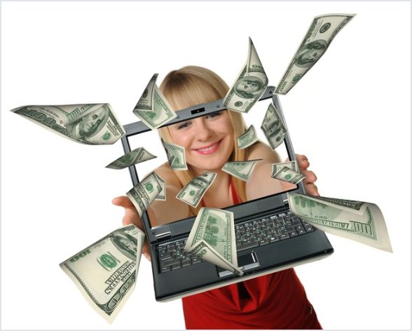 Woman with computer and money coming out