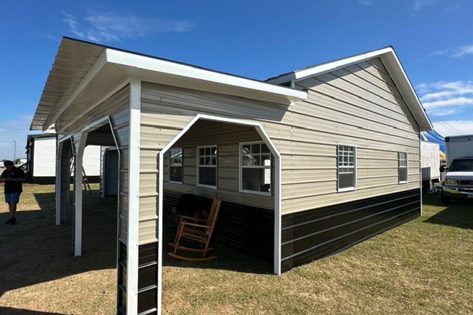Tan steel garage with attached carport and rocking chair representing steel garages in Alabama