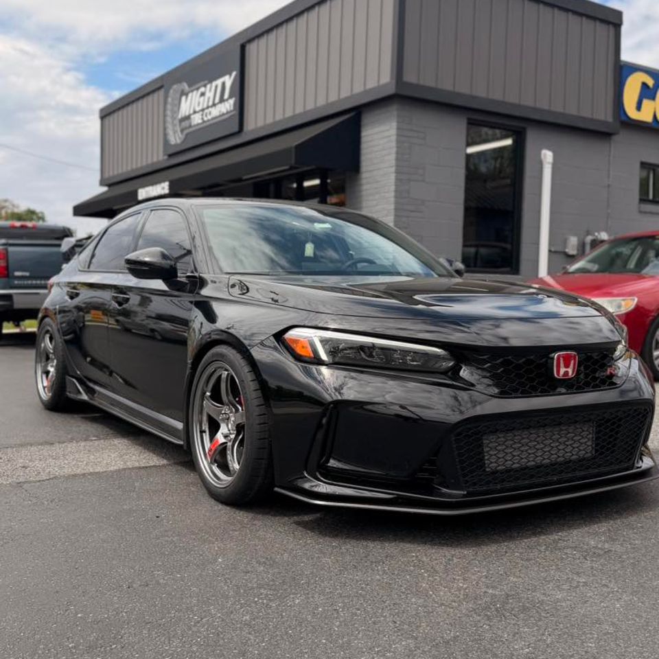 Black Honda Civic Type R with chrome wheels parked outside Mighty Tire Company in Claymont DE
