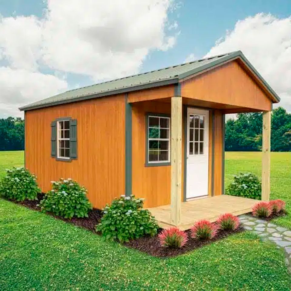 Wood tone standard cabin with covered front porch and landscaped beds in Knoxville TN
