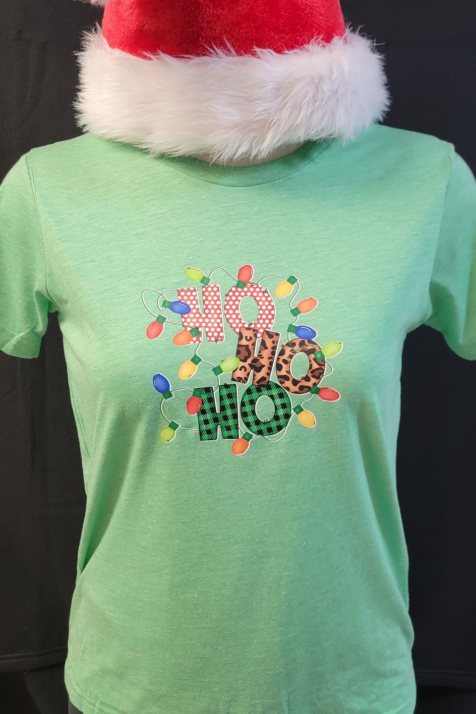 "DTF Direct-to-Film" example - Ho Ho Ho design on a green t-shirt