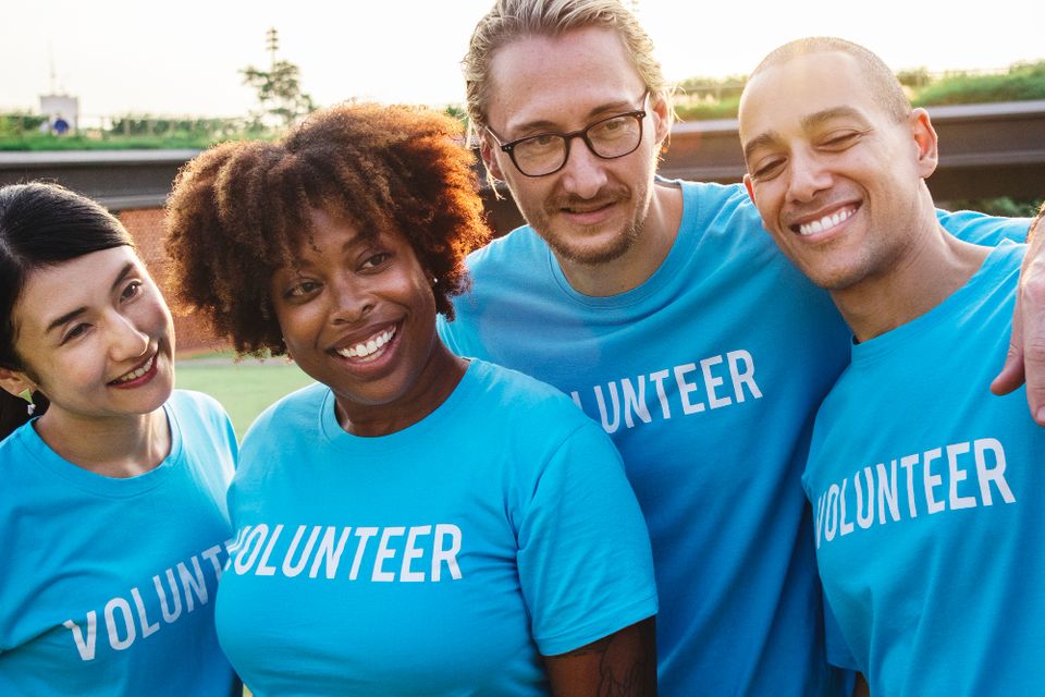 Group happy diverse volunteers