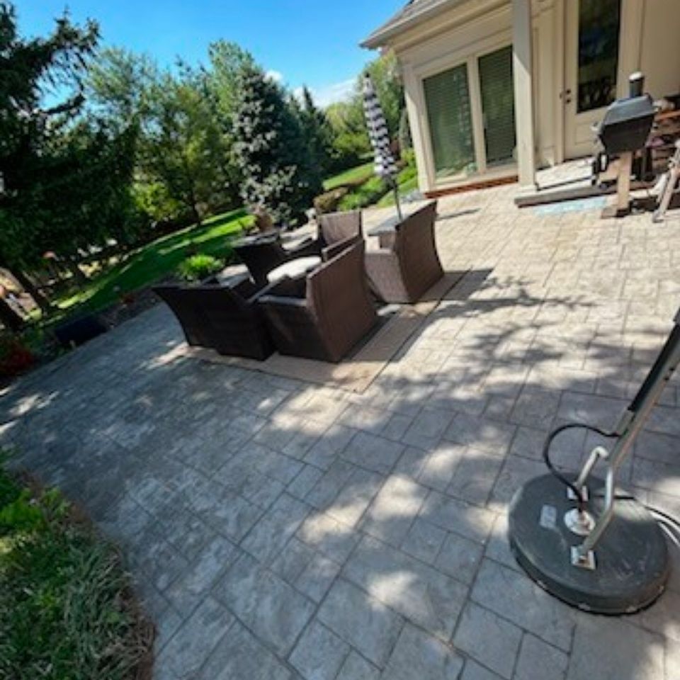 Stamped concrete patio with wicker furniture after surface cleaning in Harrisburg PA