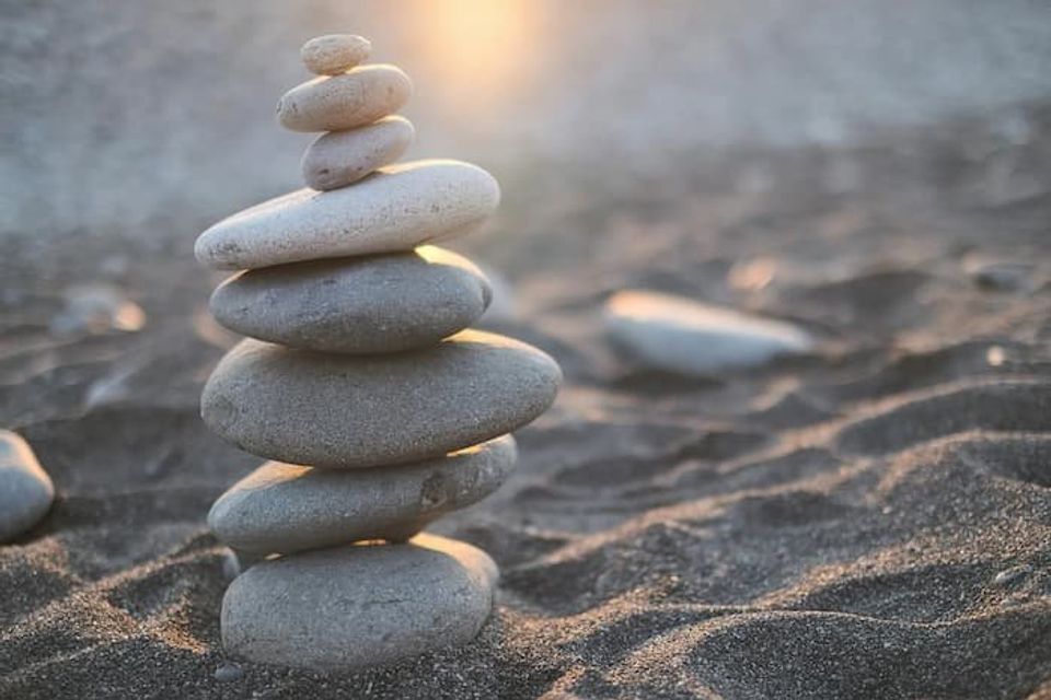 Balancing stones on a beach