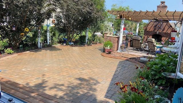 "Outdoor patio made from pavers, designed and built by Gabino Landscaping in Myrtle Beach, South Carolina."