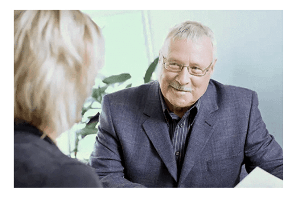 Older man talking to women