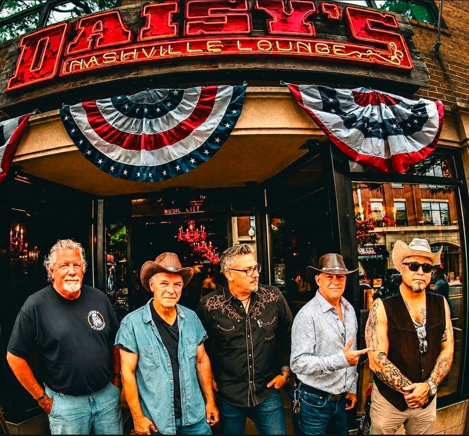 Roadside band posing outside Daisy's Nashville lounge before a performance