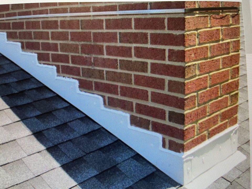 Chimney with newly installed flashing designed to help prevent roof leaks and water intrusion.