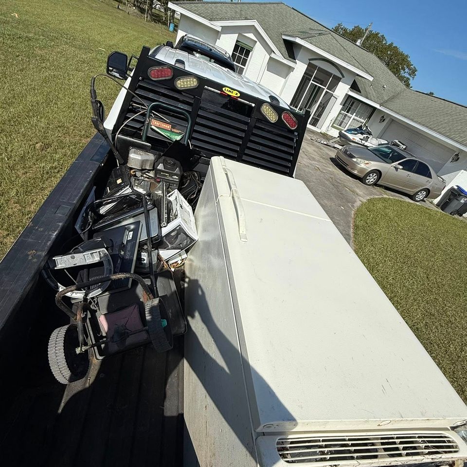 A refrigerator in the back of the JNJ Hauling Solutions truck prepared for transportation