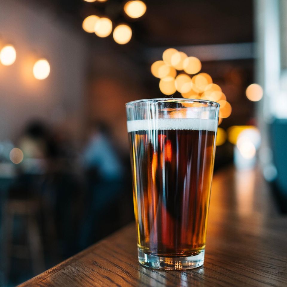 A fresh poured draft beer in a cold glass at Jilly's.