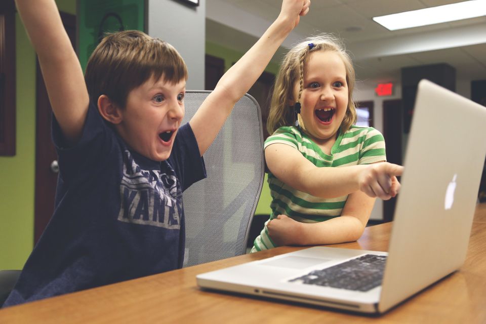 Excited kids looking at parents new website