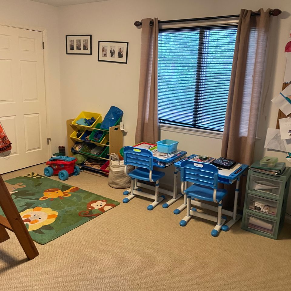 Tidy childrens playroom with organized desks and toy storage after a house cleaning service in Virginia Beach VA