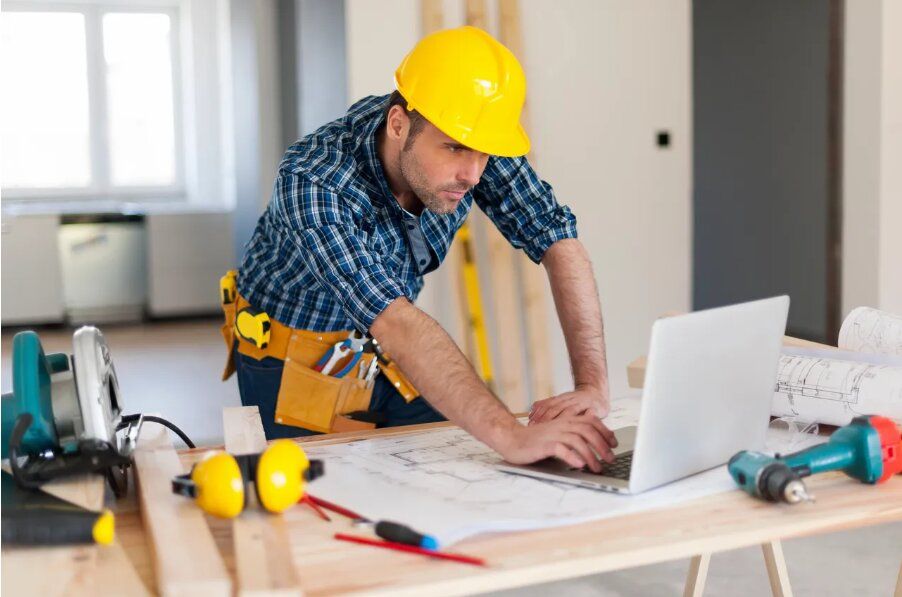 Home remodeling contractor reviewing plans for a residential project in Spring, TX