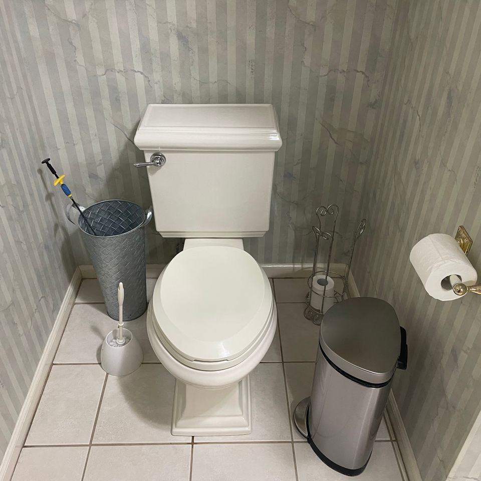 Sparkling clean toilet and tidy bathroom corner after a house cleaning service in Virginia Beach VA